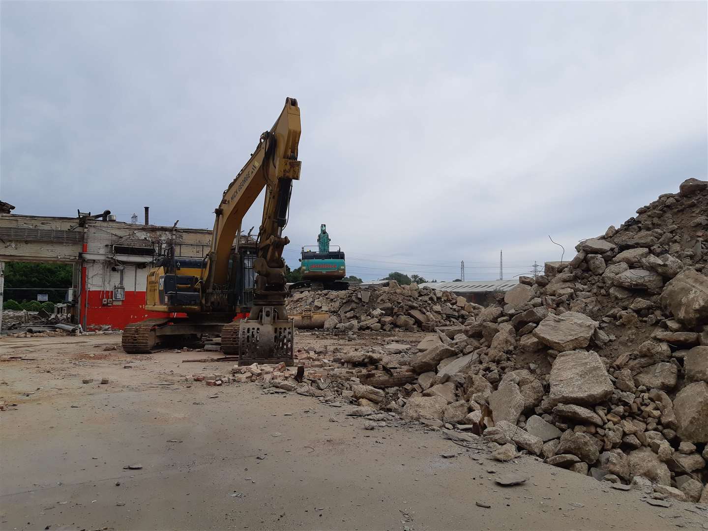 Heavy machinery is being used to remove buildings and move materials (57923238)