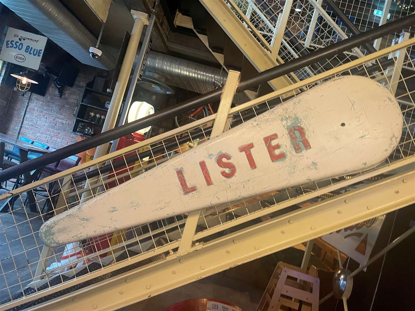 The steel stairway to the first floor bar