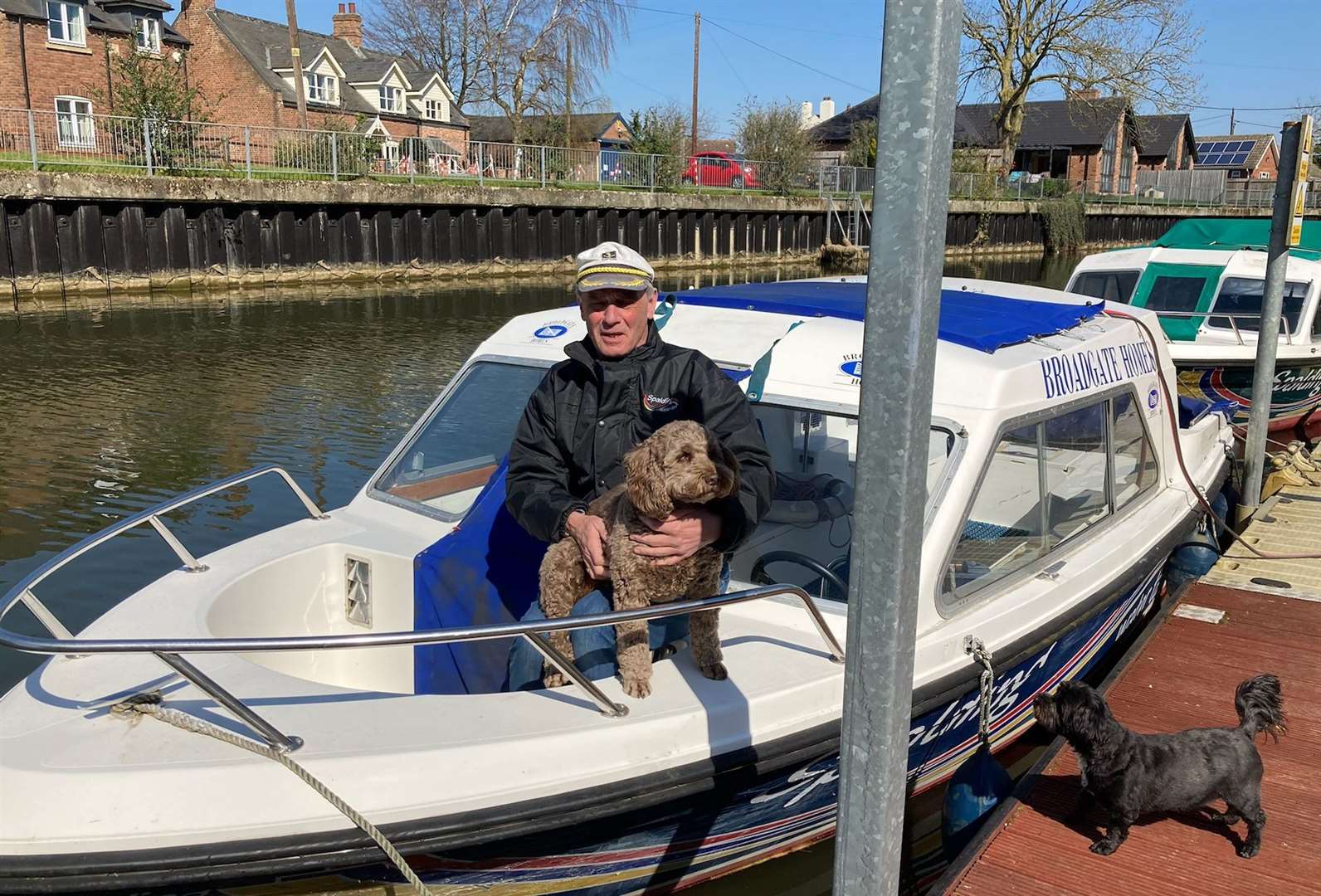 Anthony Grunwell and dog Archie with one of the Spalding Water Taxis.