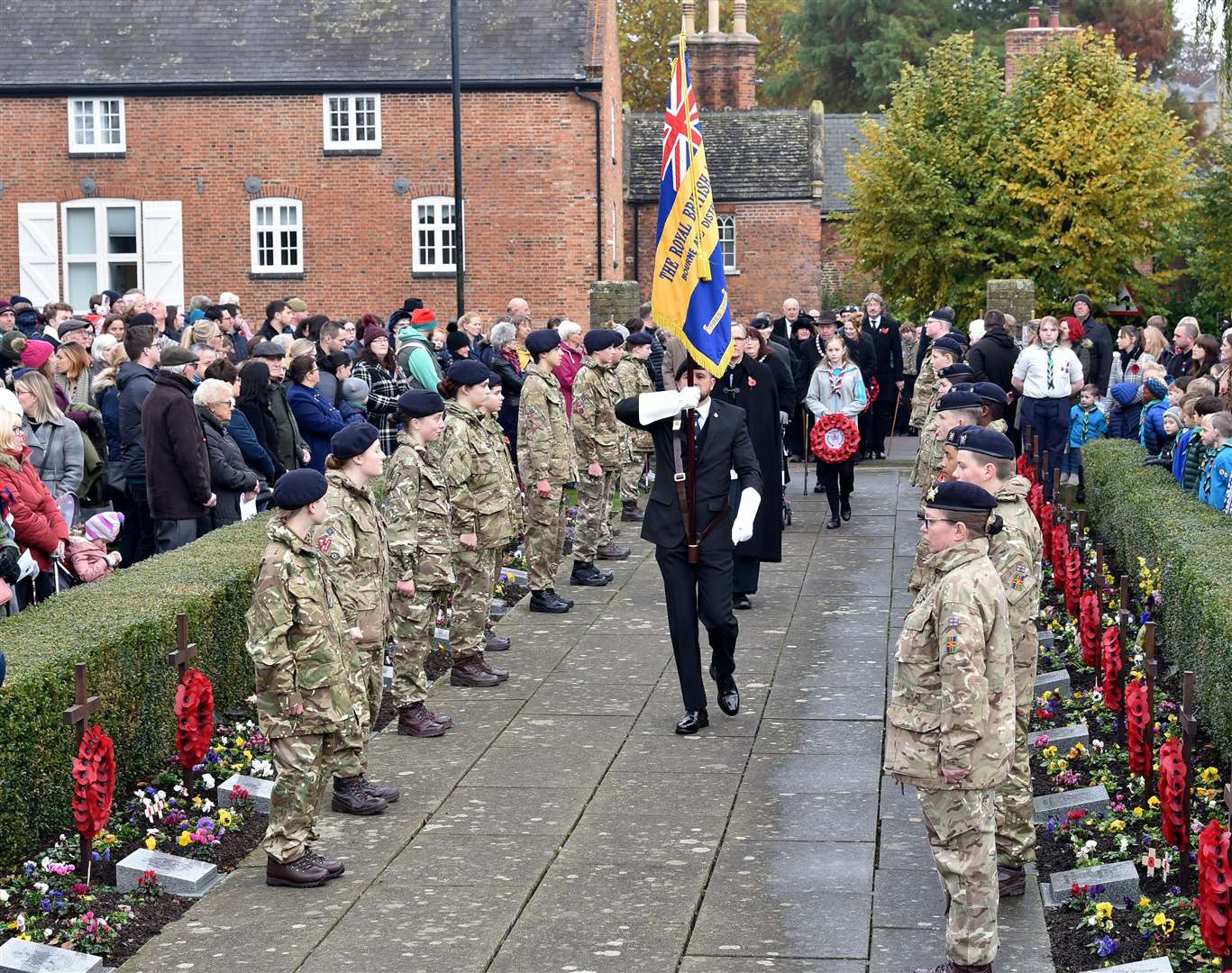 The parade arriving in the Wellhead gardens