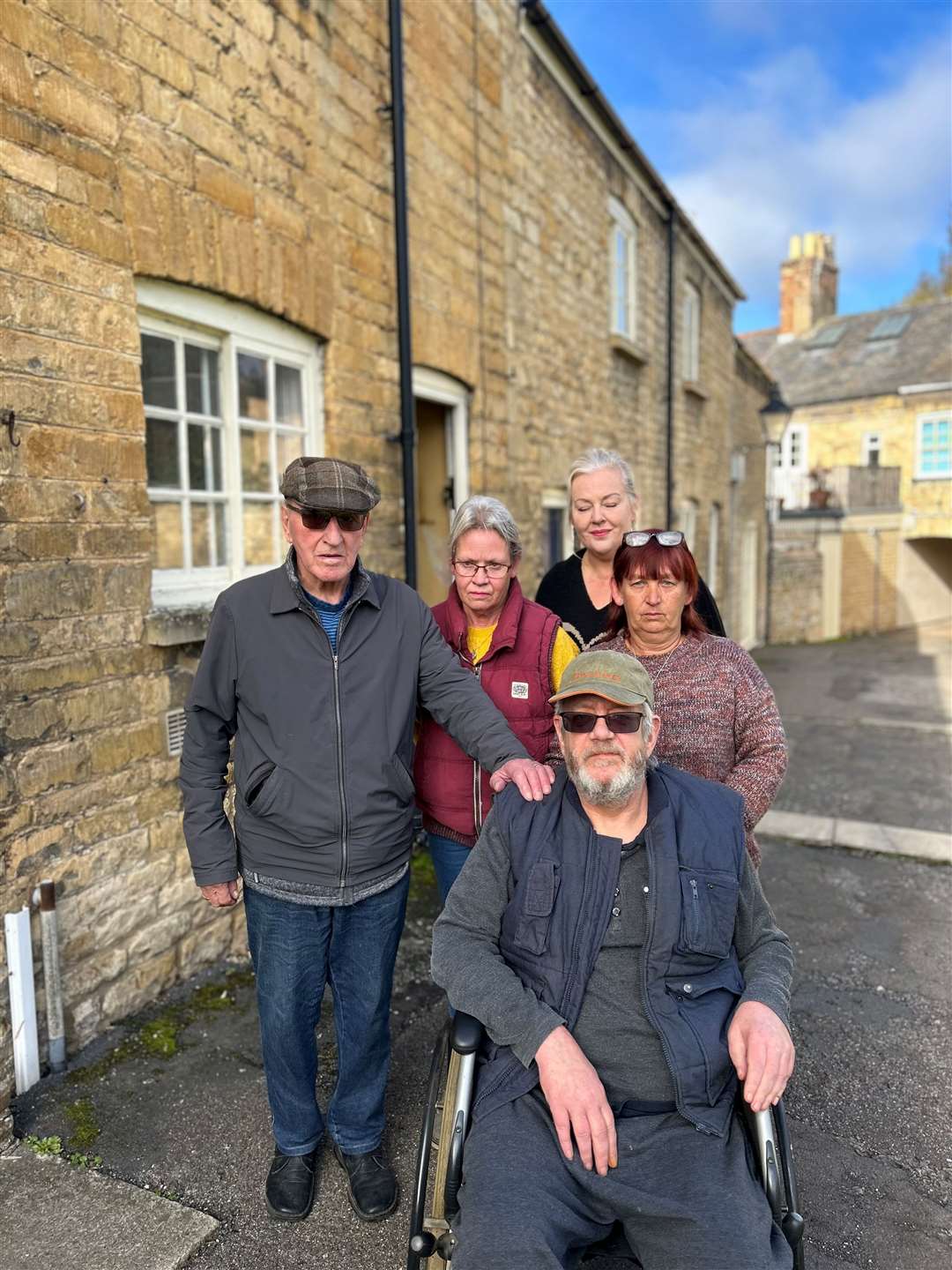 Derrick Middleton, Sheen Ogle, Madeline Nelson, Suzette Waldron and Paul Robinson outside their homes in Lumbys Terrace, Stamford