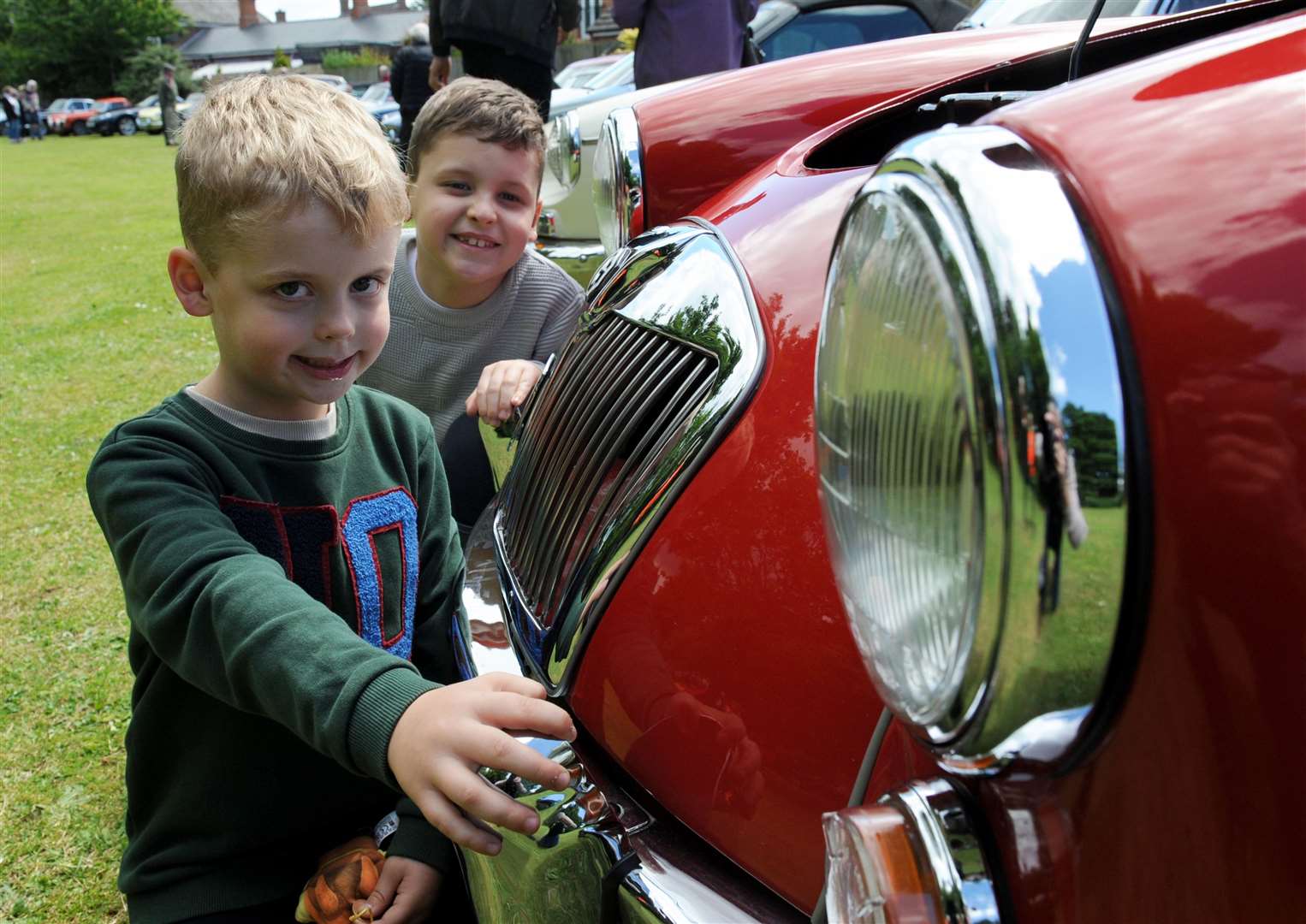 Max (7) and Josh Thomas (5) get up close with one of the classic cars. Photo: Iliffe Media
