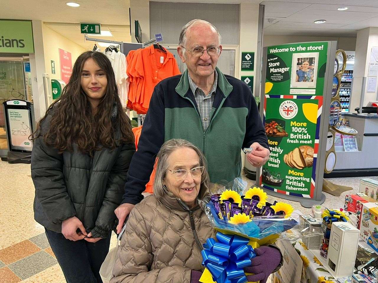 Ann Redford won the tombola star prize. She is pictured with her husband Dennis and Stamford Supports Ukraine volunteer Catalina