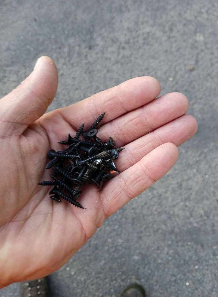 Nails picked up by a resident that are being scattered on the road in Whaplode