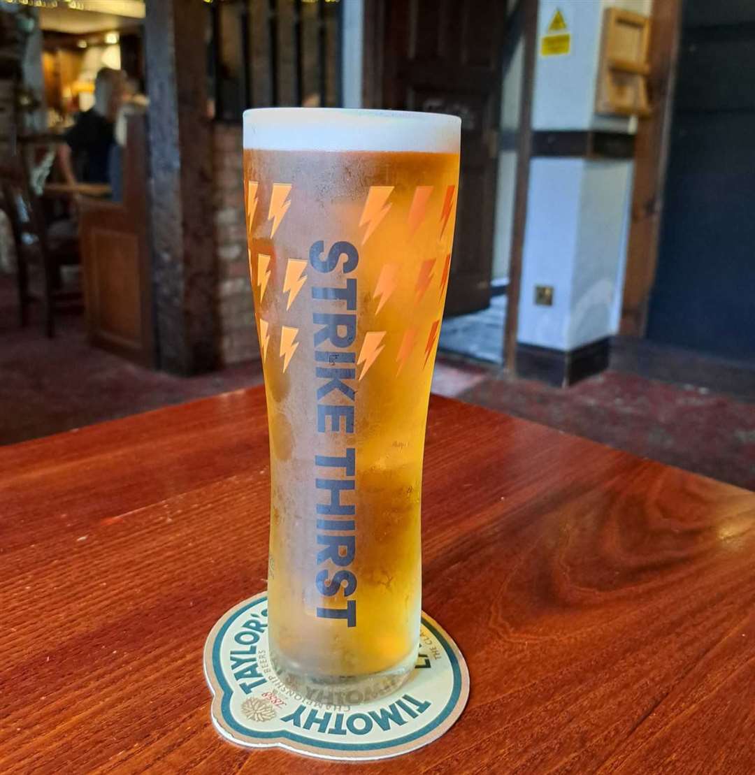 A pint of Timothy Taylor's Hopical Storm. I liked it a lot