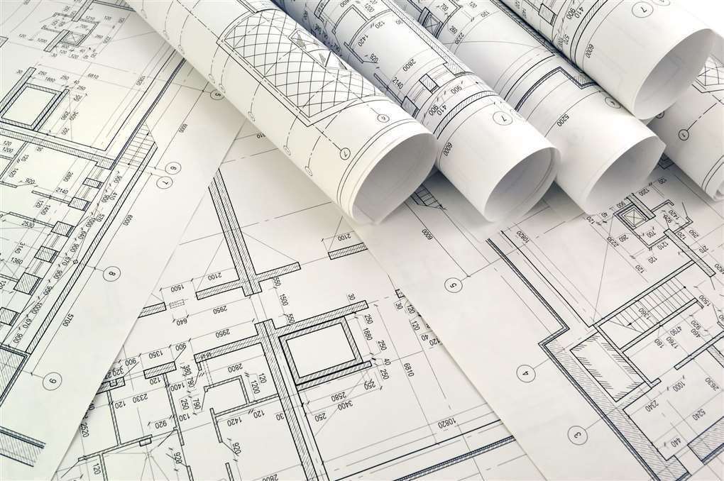 Photo drawings for the project engineering work credit: iStock/GeorgiMironi
