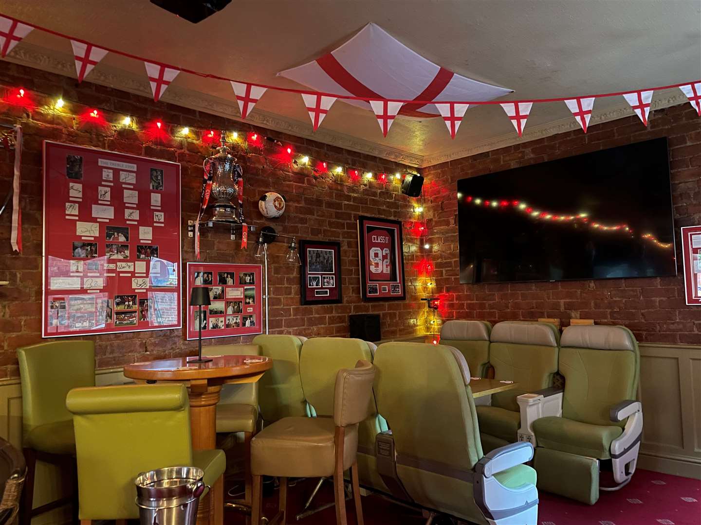 The comfiest chairs imaginable below the footie memorabilia