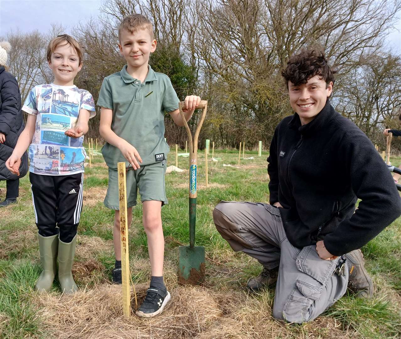 Lochie Hanwell, 8, and Jack Poulton, 8 with Burghley Estate forester Joe Haines