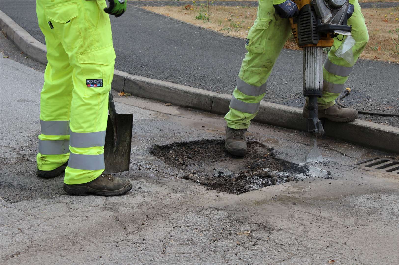 A pothole being filled