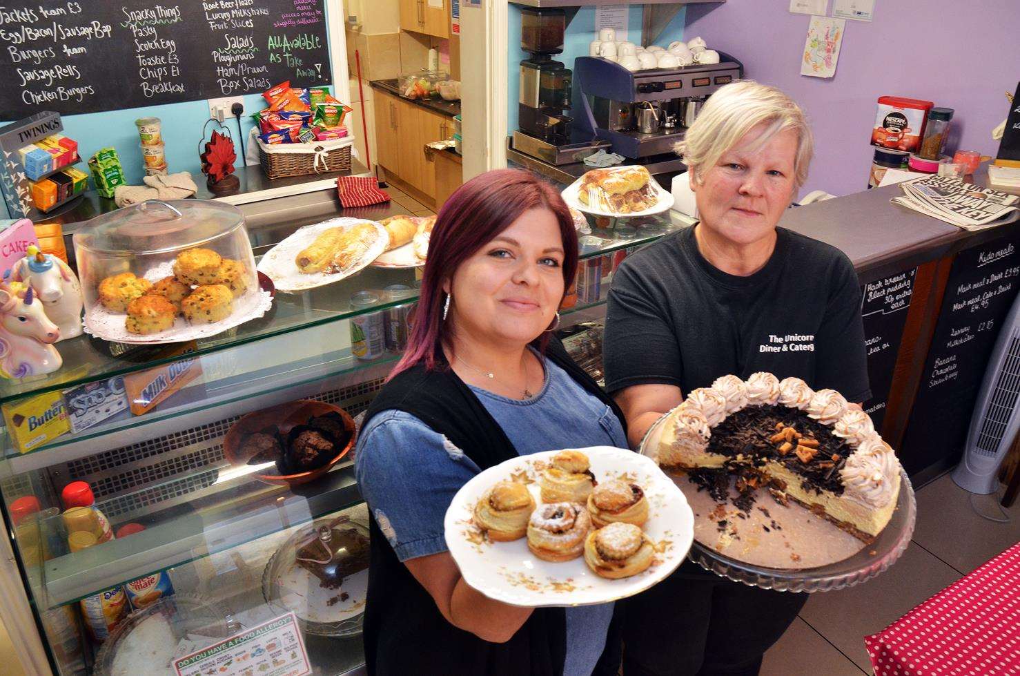 Pippa Dawson and Michelle Jackson with mince pies and cake.