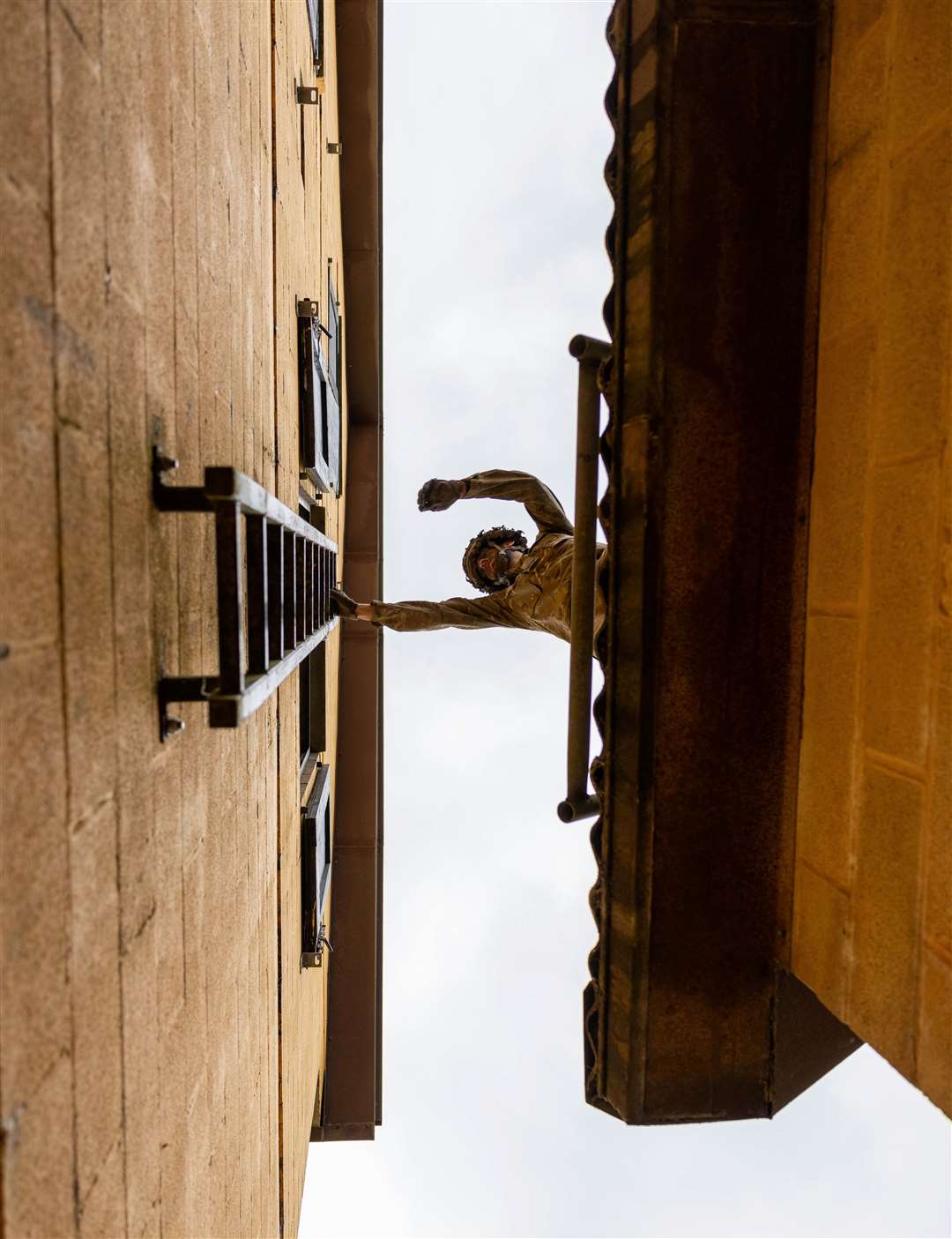 Climbing from one building to another.