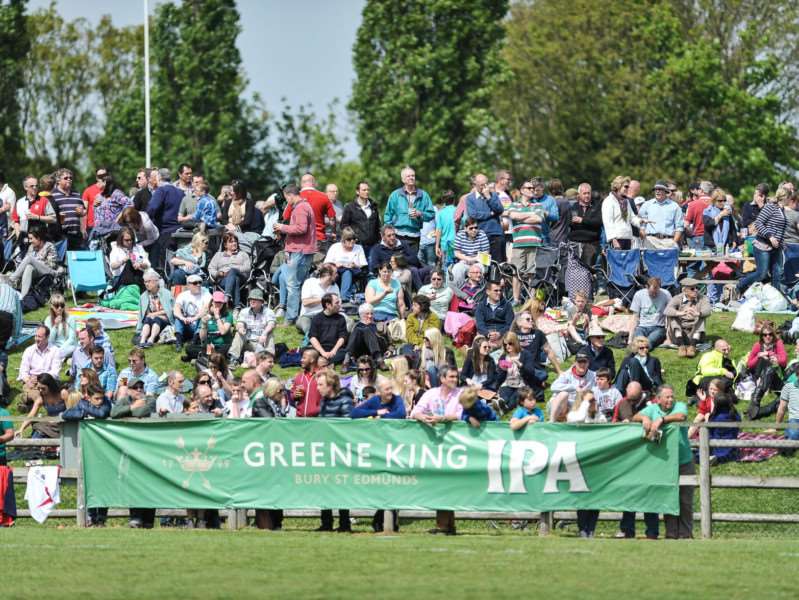 PACKED OUT: Crowds enjoying the action from the hill during the 2014 tournament, which was played out on a baking hot day. Picture: Roger Arbon