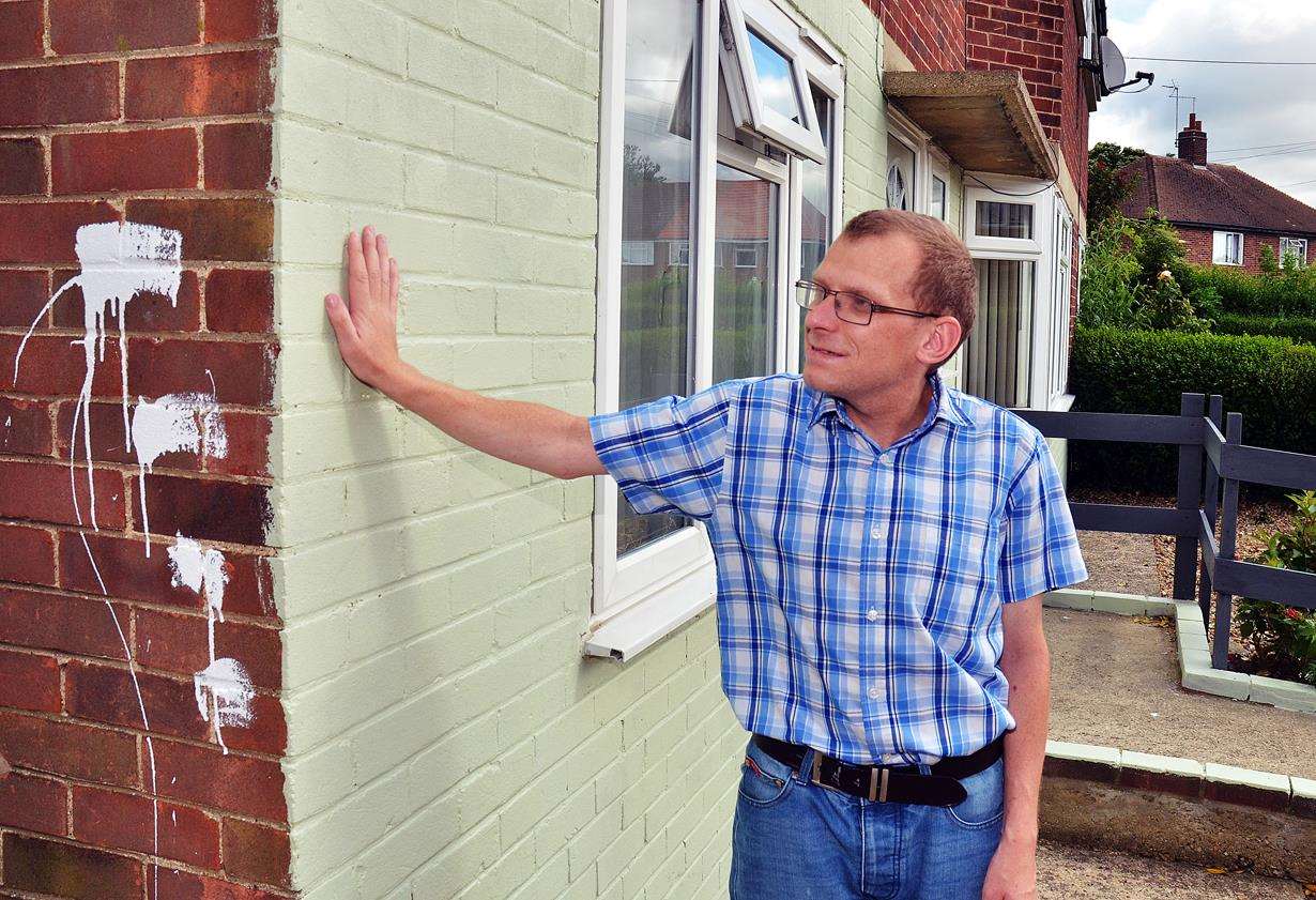 Matthew Poxon, houe repainted after vandals grafitti it (2642516)