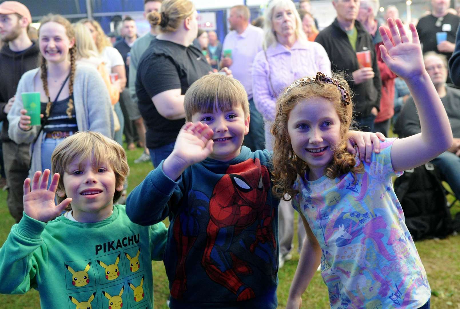 Jessie Wood, six, Juliet Wood, eight, and Otis Davey, six, at Bourne Festival 2023. Photo: Chris Lowndes