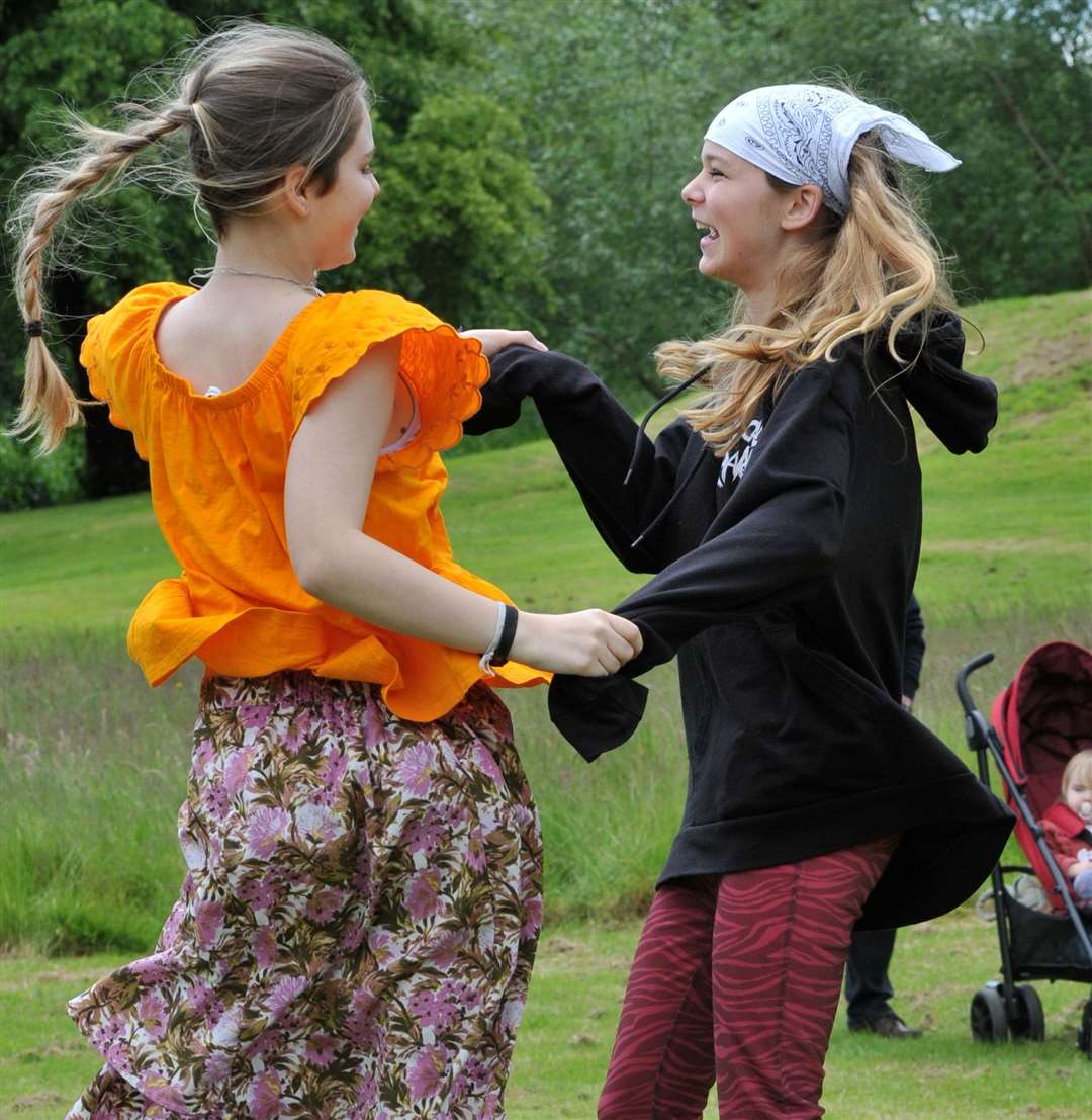Sisters Ava and Amelia Poole dance along to the live music. Photo: Iliffe Media