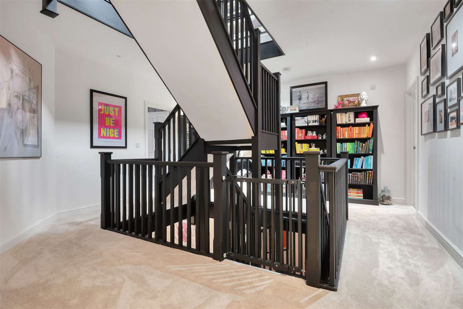 A bespoke staircase runs through three floors