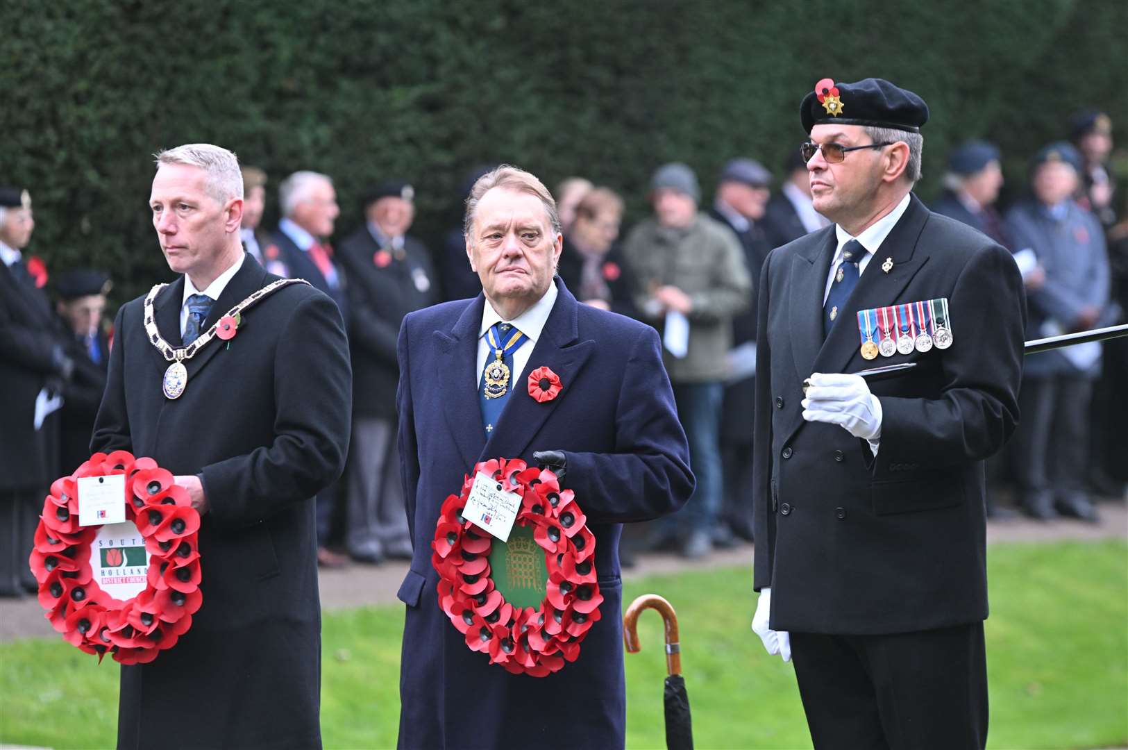 Coun Andrew Woolf and Sir John Hayes lay wreaths