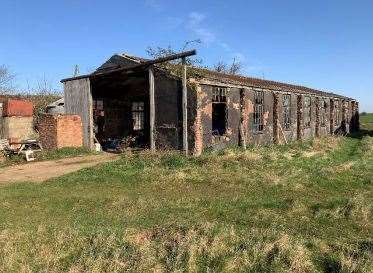The barns that could become five homes. Photo: SKDC Planning / Lucy Wood Architects