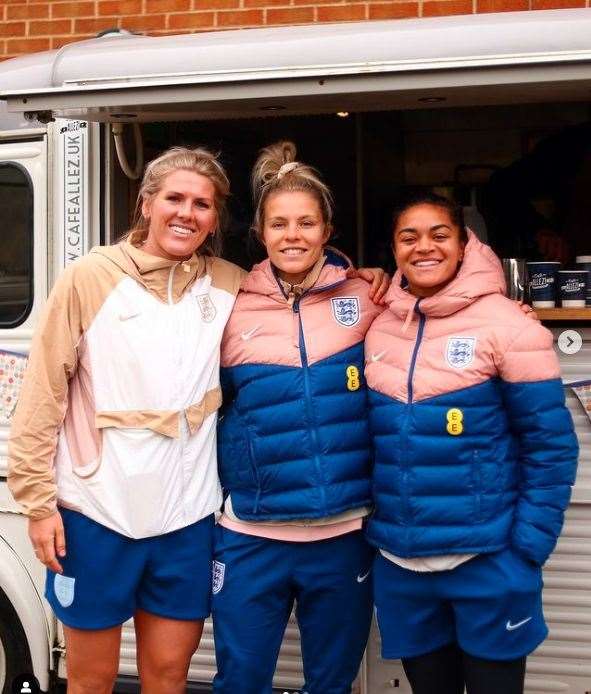 The Lionesses outside the Cafe Allez! mobile shop.