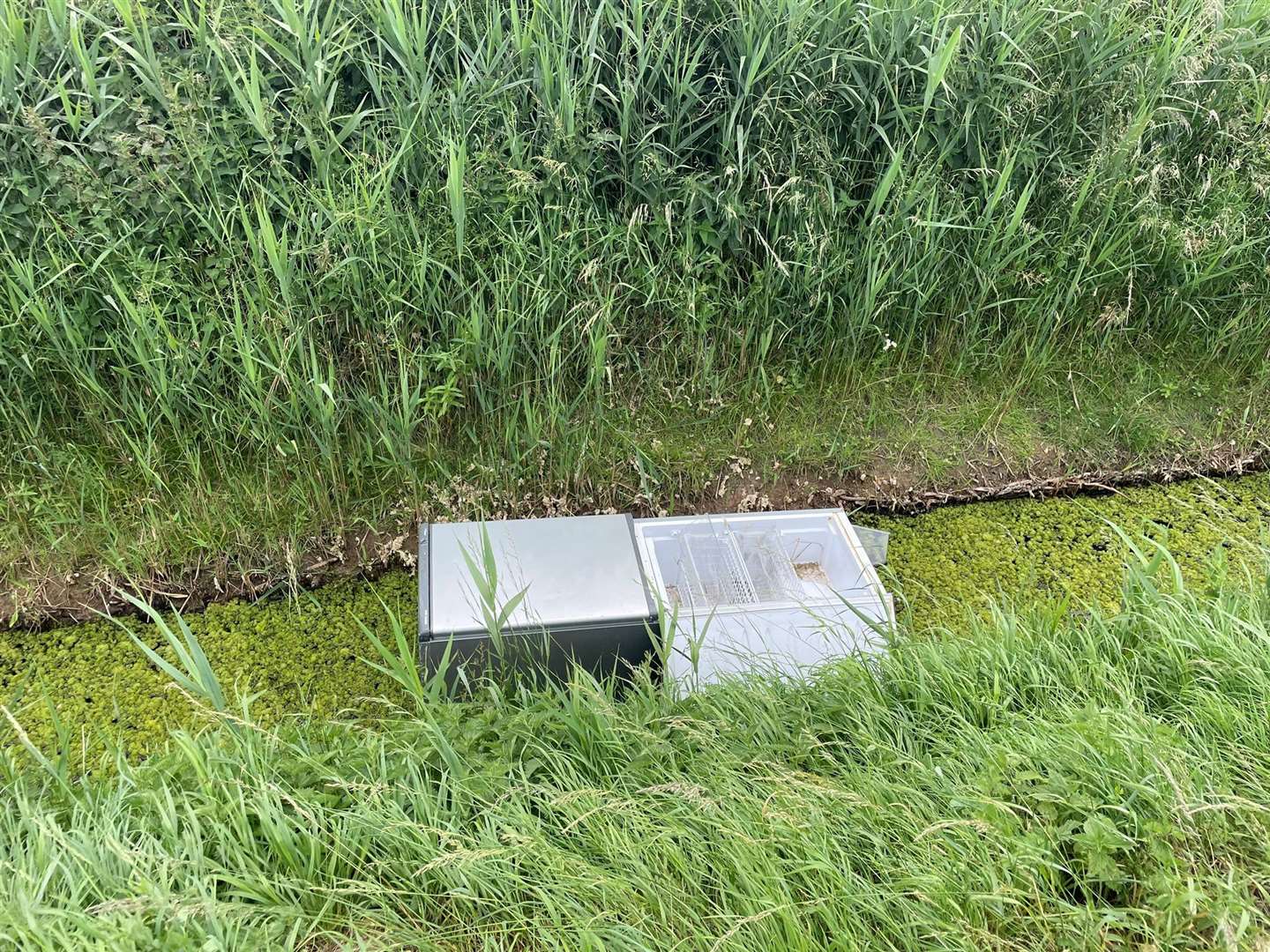 A fridge freezer dumped in a dyke in Old Leake