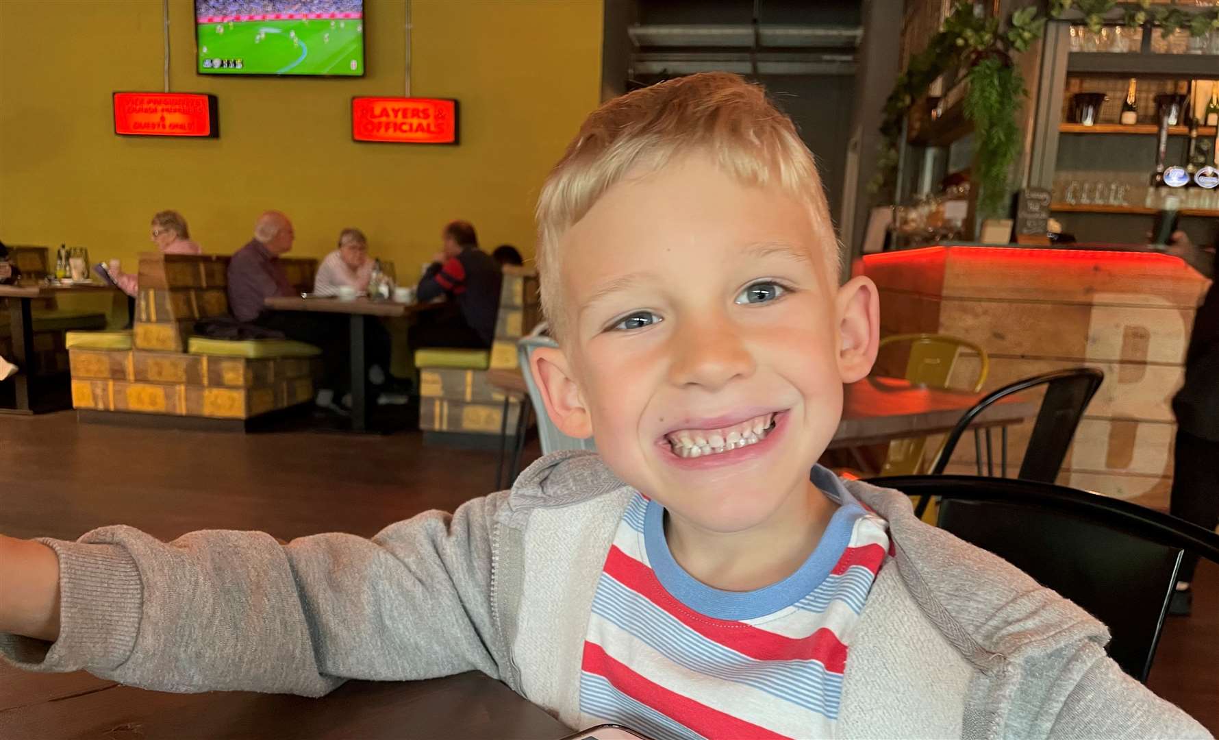 My young dining companion was all smiles after the sausage and mash