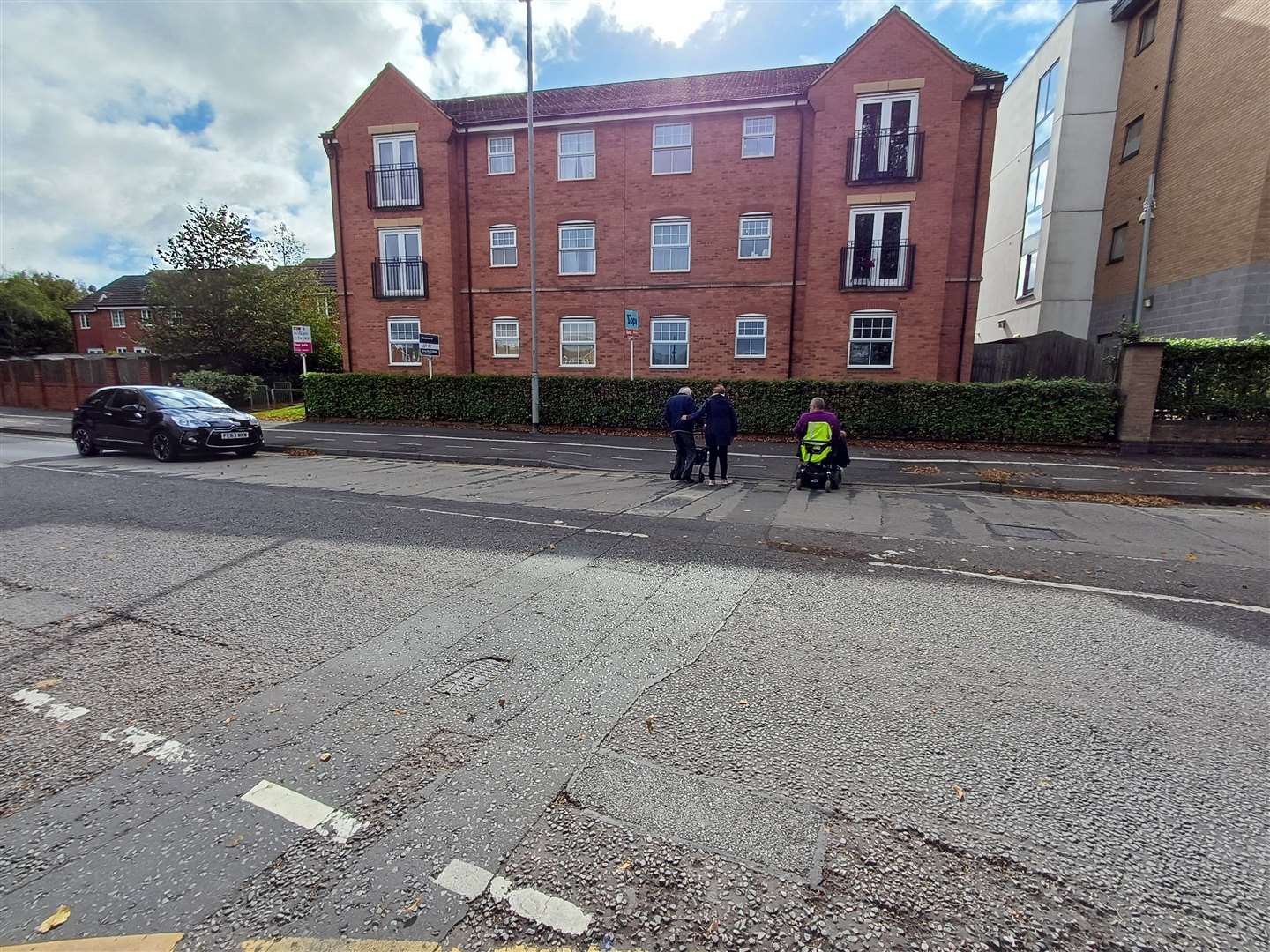 An alternative route along a smoother path means crossing a busy road with almost blind bends and potentially relying on kind drivers to let residents cross. Photo Daniel Jaines