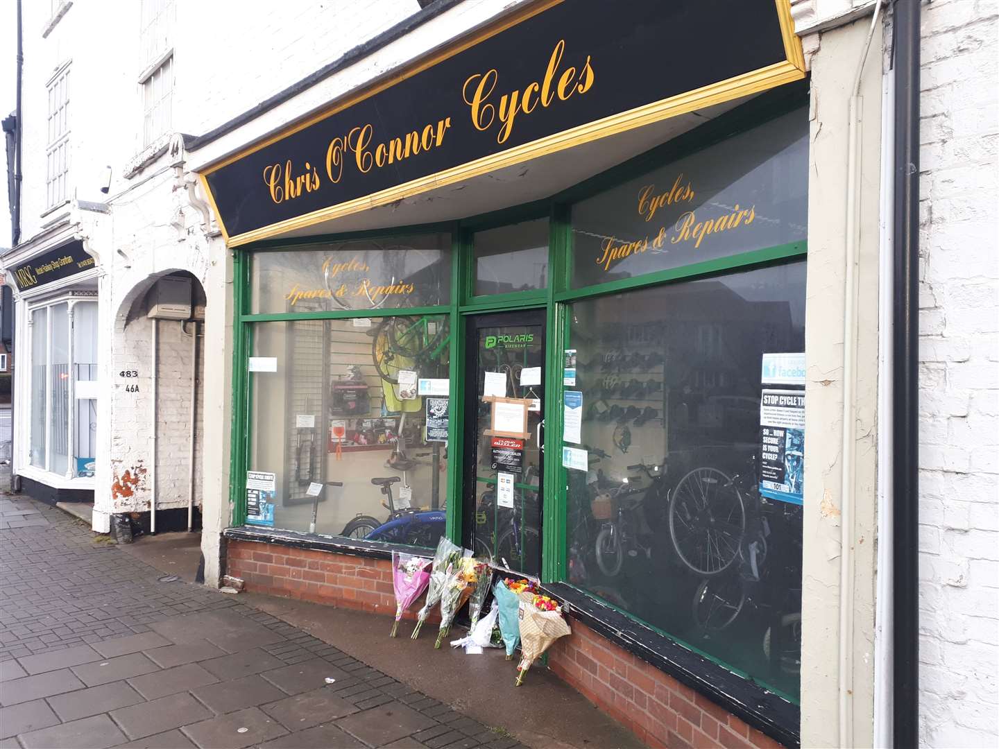 Flowers placed outside Chris O'Connor Cycles on Watergate. (44237045)