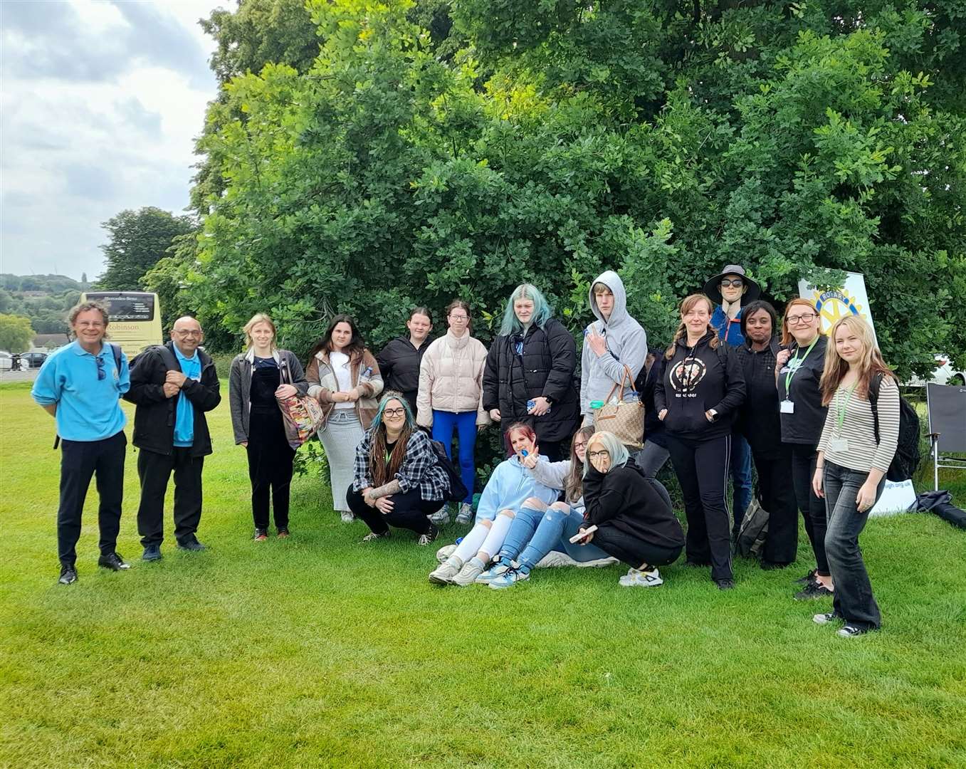 A group of excited students preparing for their next adventure at the theme park.