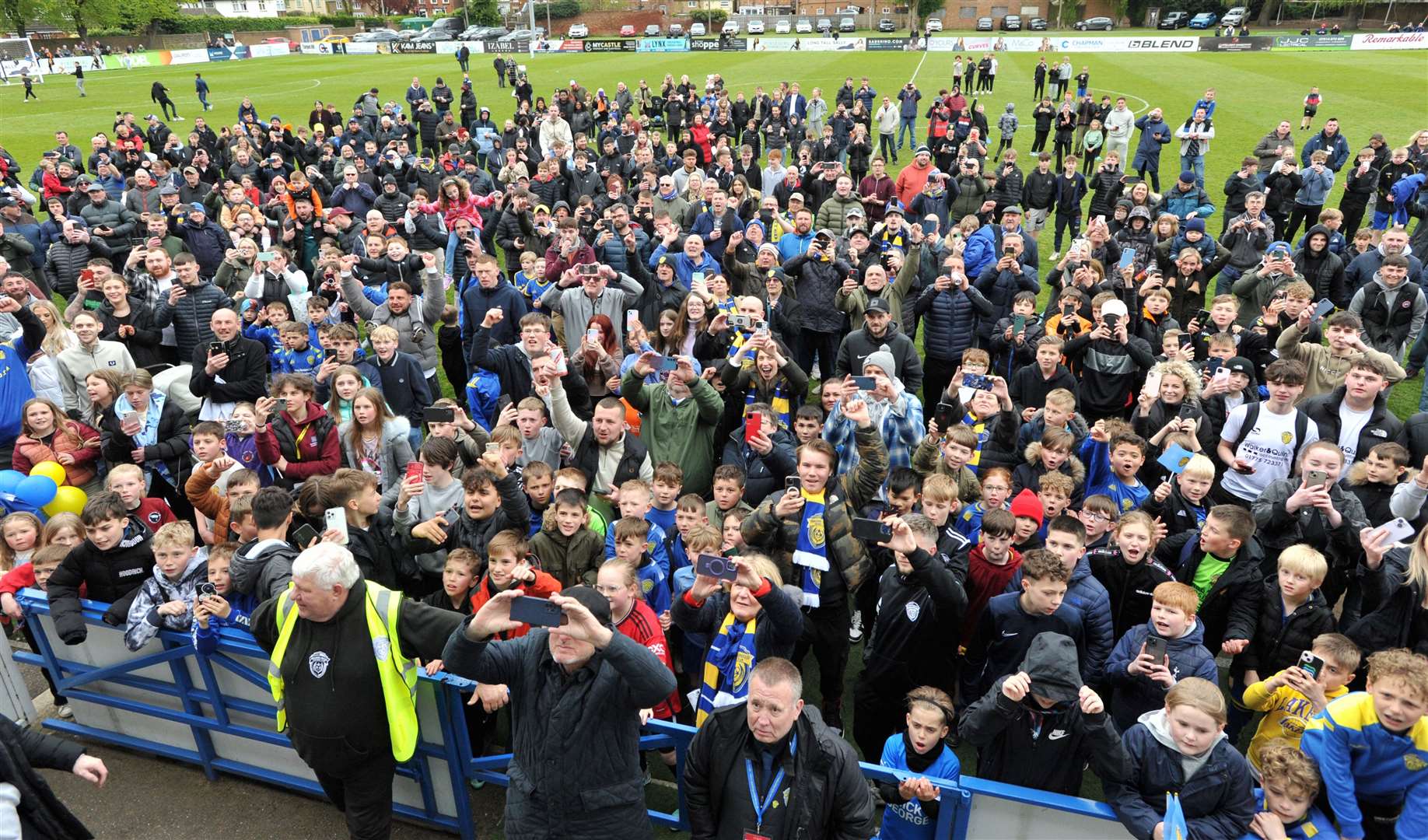 Fans get ready for the trophy presentation. Photo: Chris Lowndes