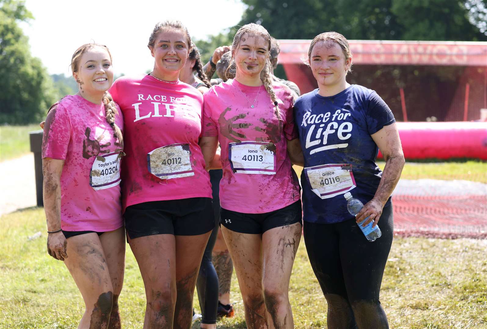 Friends take a breather mid-race during last year's event. Photo: Paul Marriott