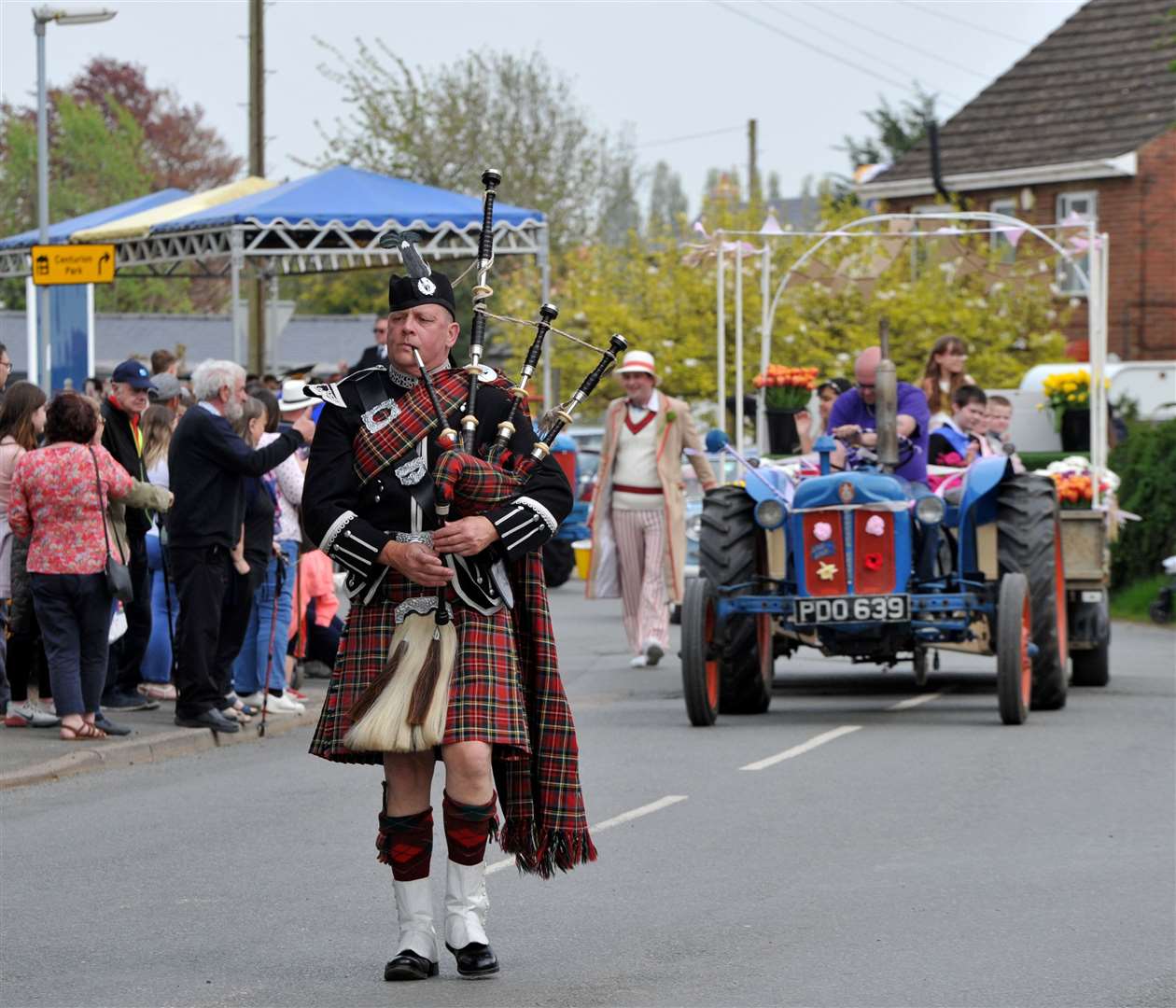 A piper leads Moulton Chapel Tuliptime Parade