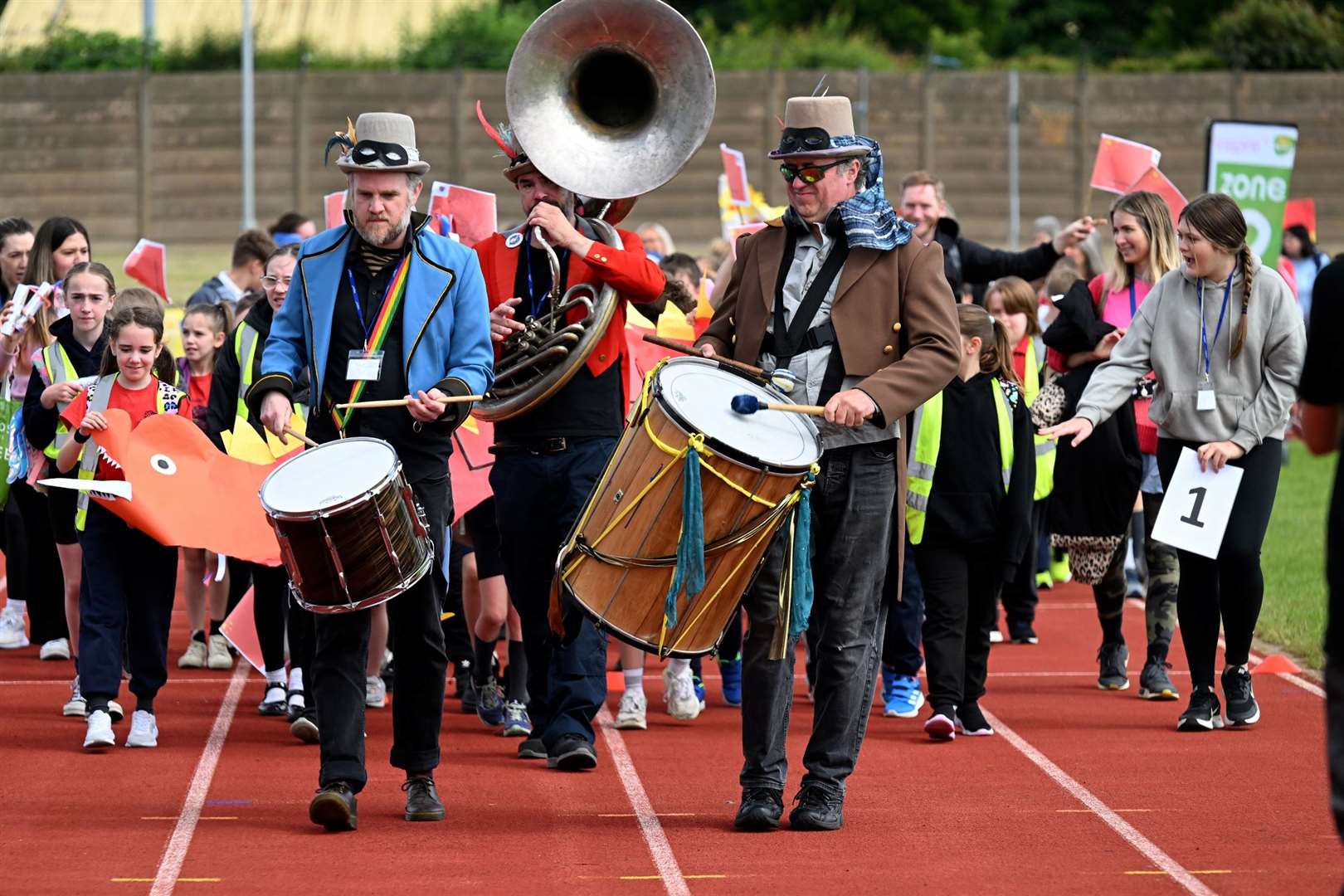 The band leads the schoolchildren on day two.
