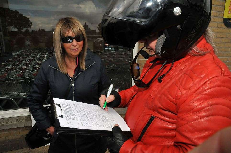 Bourne Road resident Amanda Halifax with a petition supporter. (110519-17)