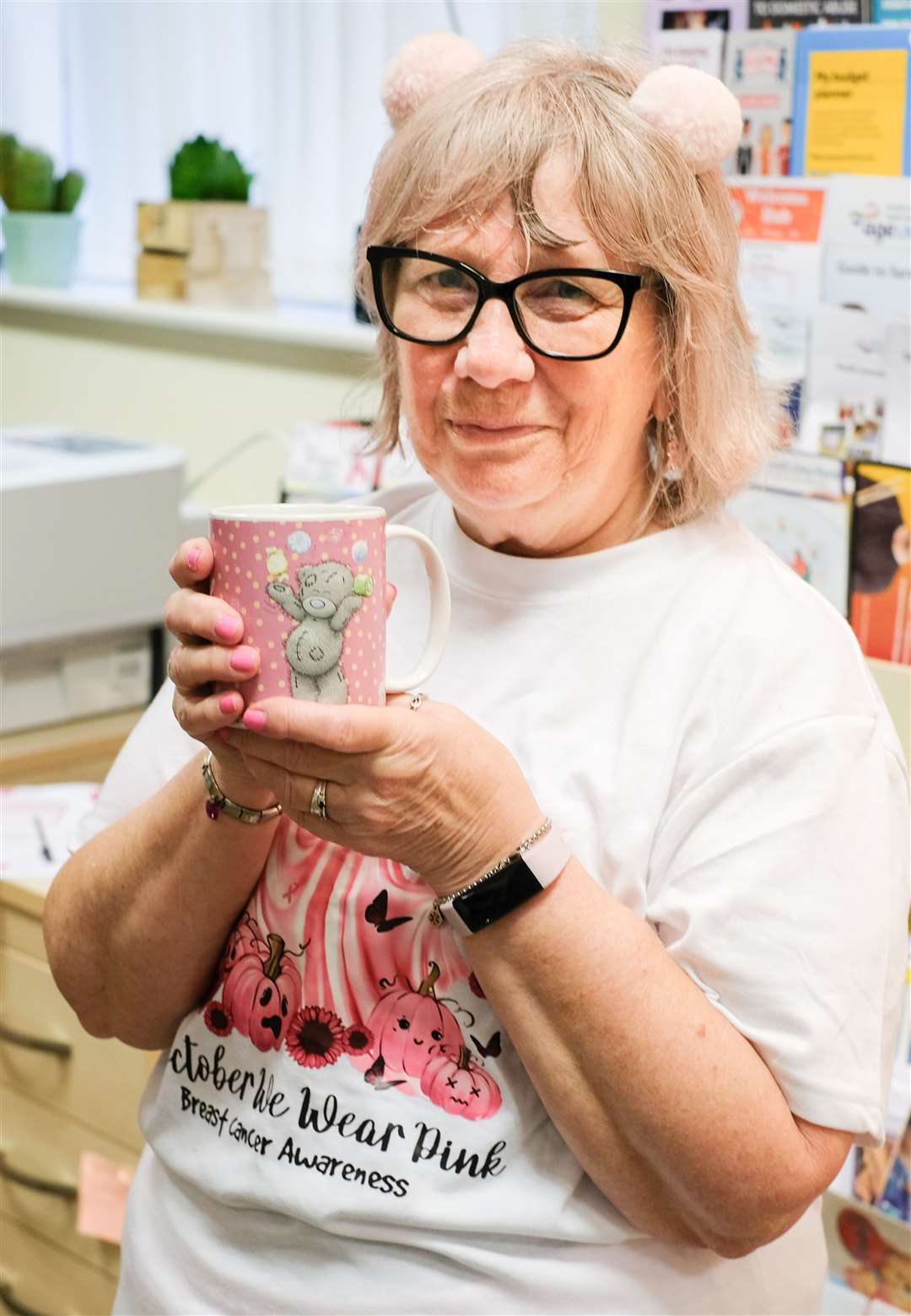 Boxes of Hope receptionist Carol Houlden who is wearing pink throughout October in aid of Breast Cancer Now. Copyright Ken Smith