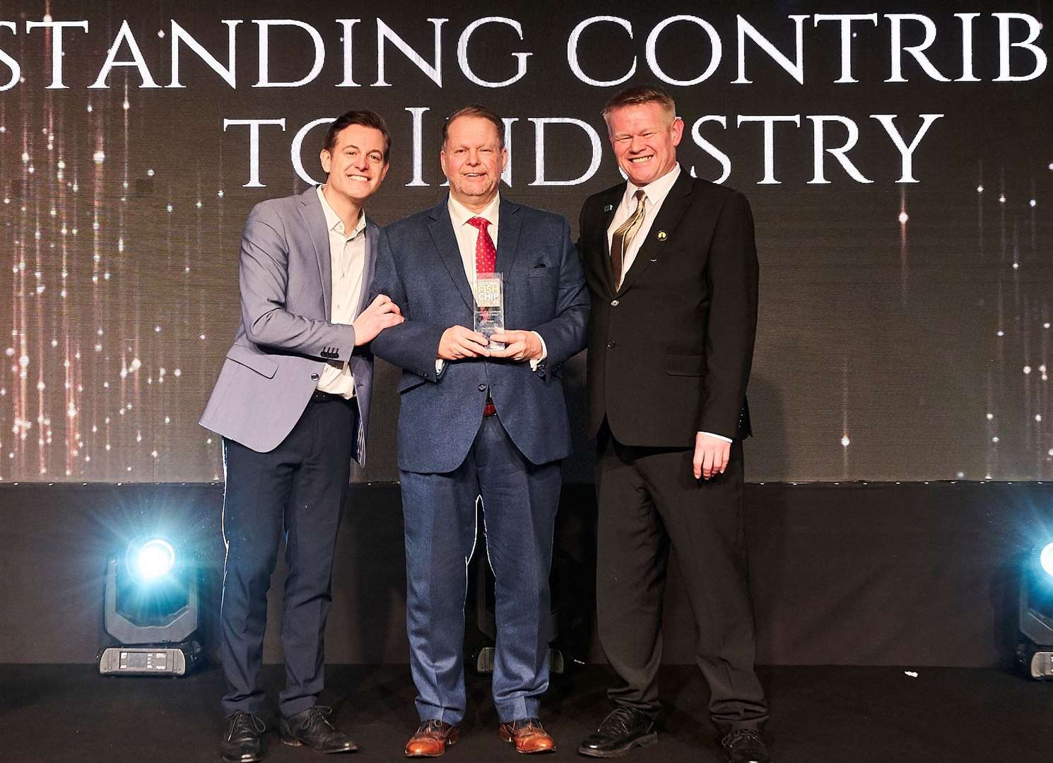 Paul was presented with his award by TV presenter Matt Baker and Andrew Crook, president of the National Federation of Fish Friers