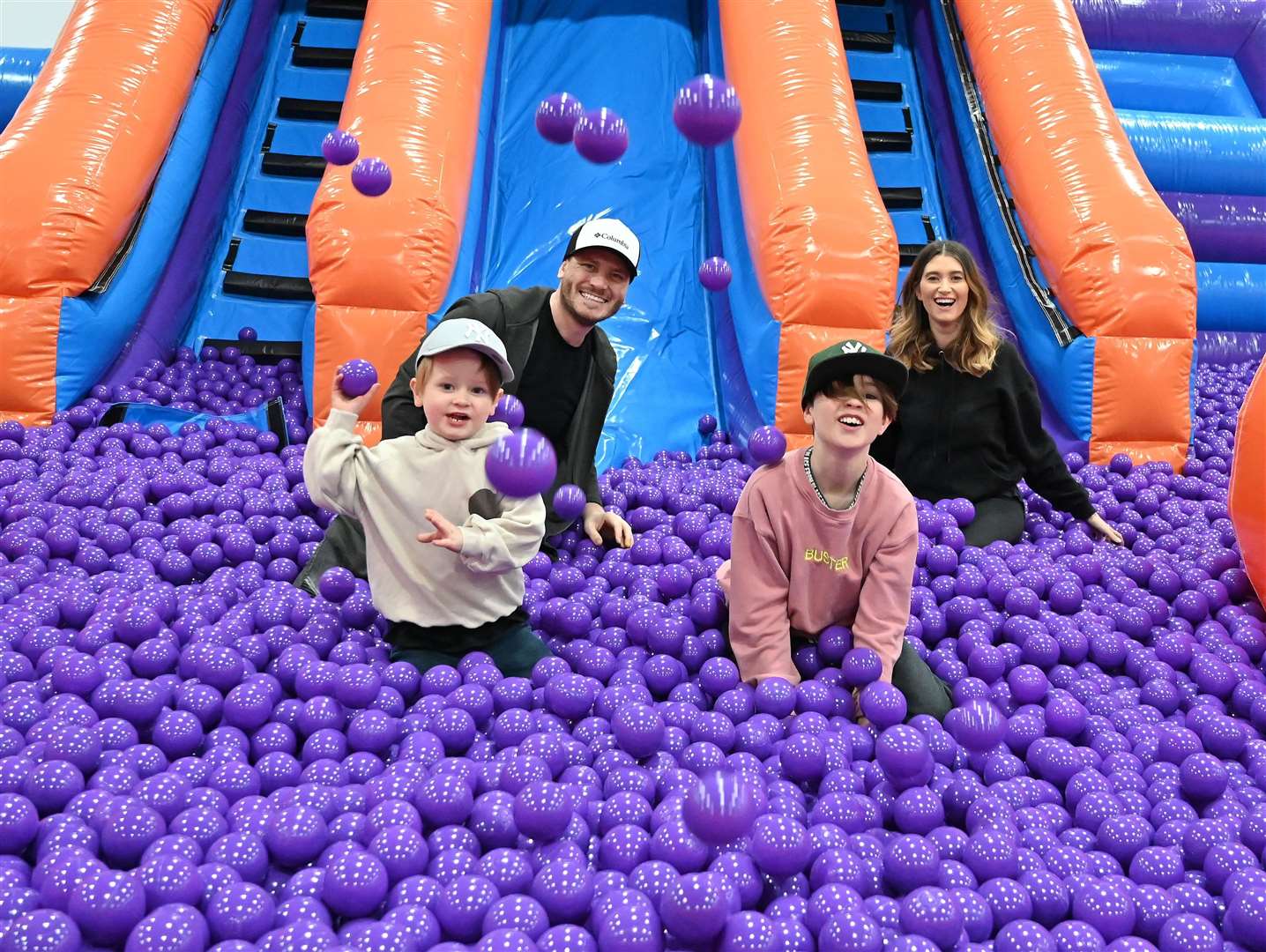 Emmerdale actors Matthew Wolfenden and Charley Webb with sons Buster and Bowie at the VIP preview of Inflata Nation Peterborough