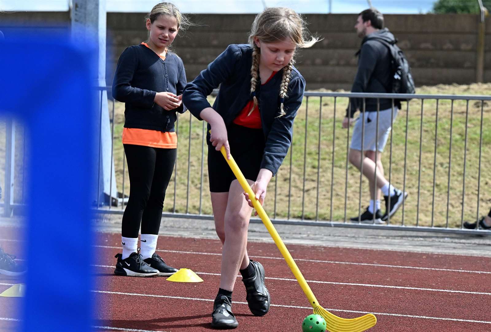 Children having a go at hockey on day one.