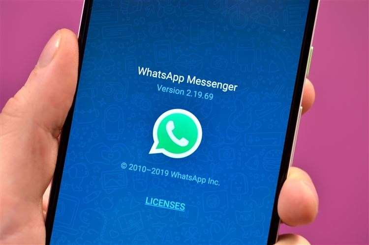 Stock photo of the WhatsApp app icon on a smartphone. (60203003)
