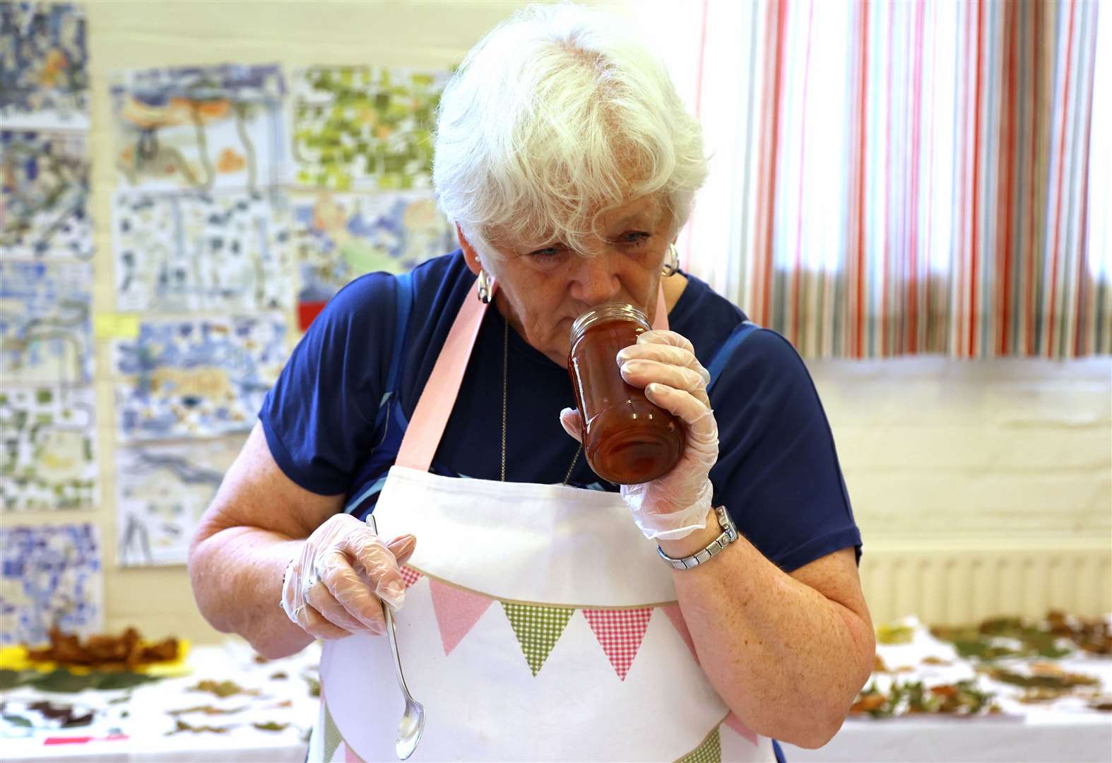 Tracey Wells, from the West Pinchbeck WI, judges the jams and pickles