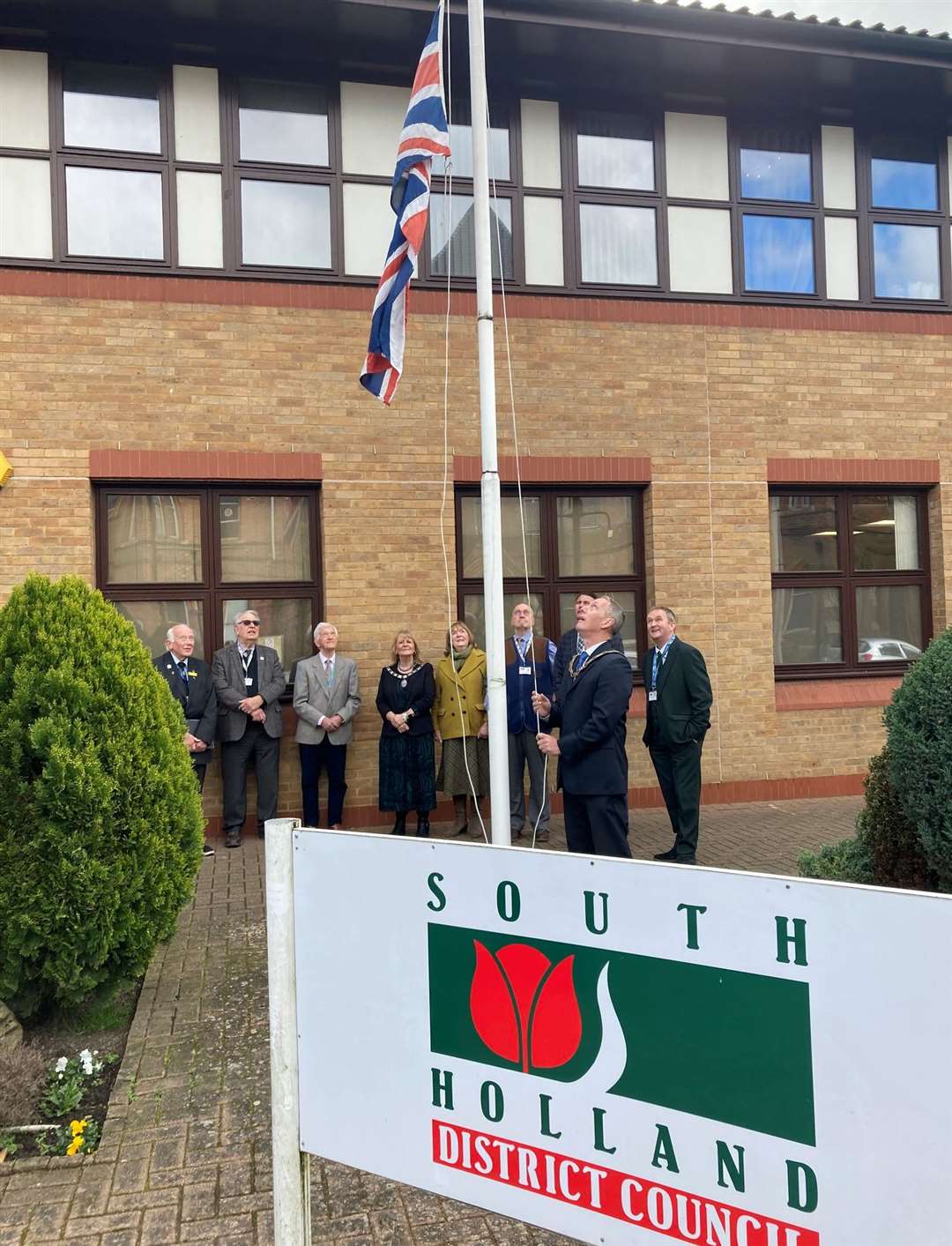 Chairman, Coun Andrew Woolf, raises the Union Flag outside the offices of South Holland District Council to celebrate the 50th anniversary