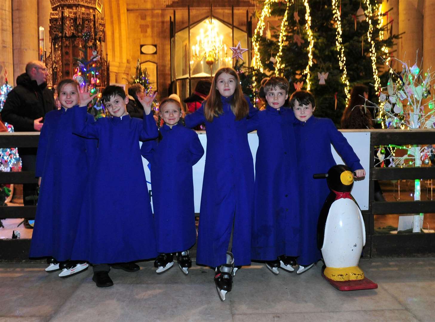 Choir members next to the church's ice rink.