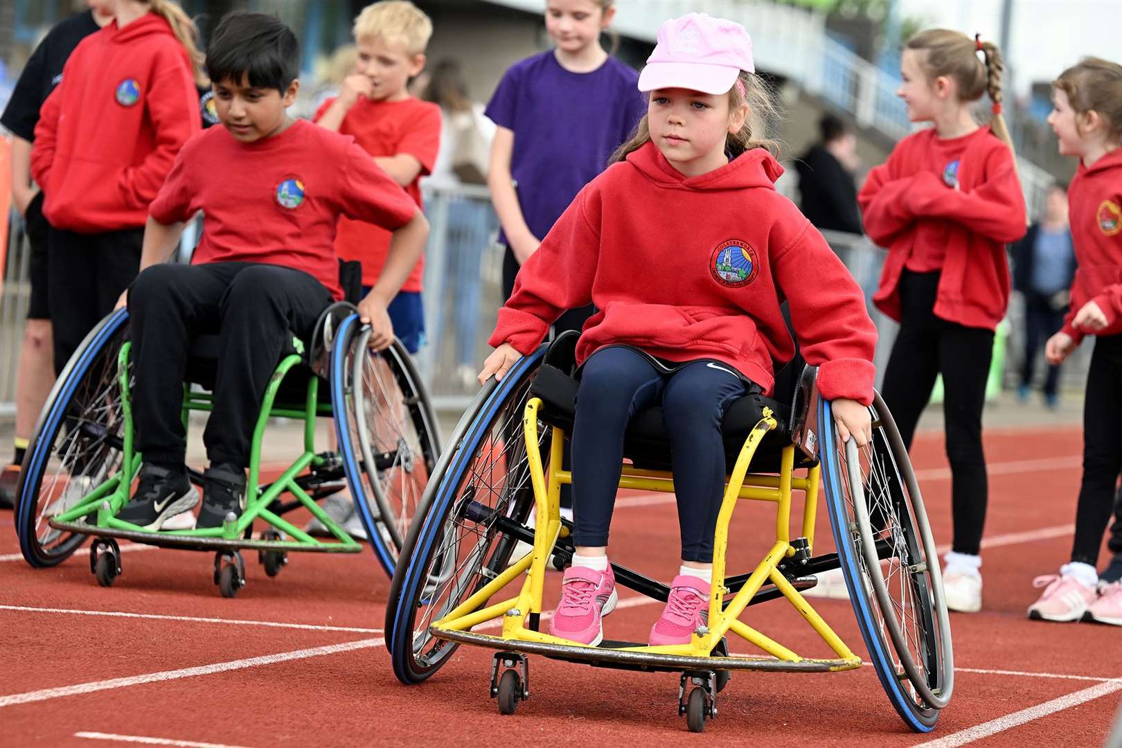 Children attempting wheelchair racing on day two.