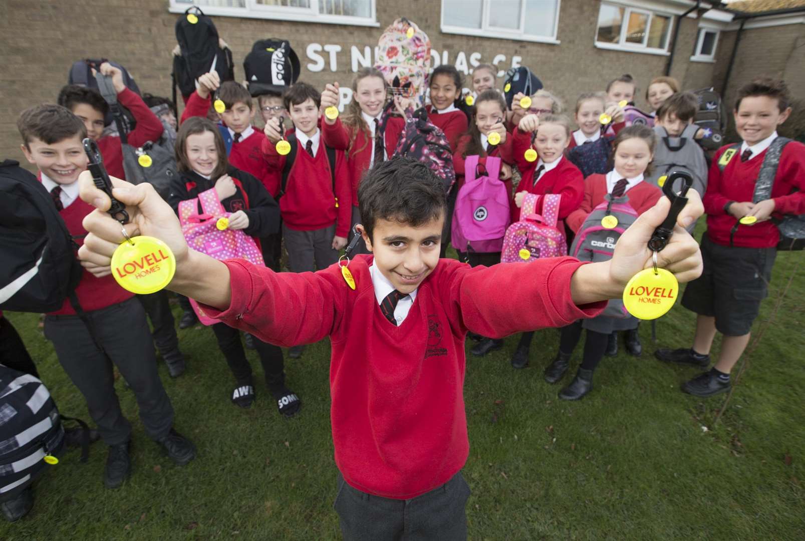 Pupils at St Nicholas Primary School show off their new tags