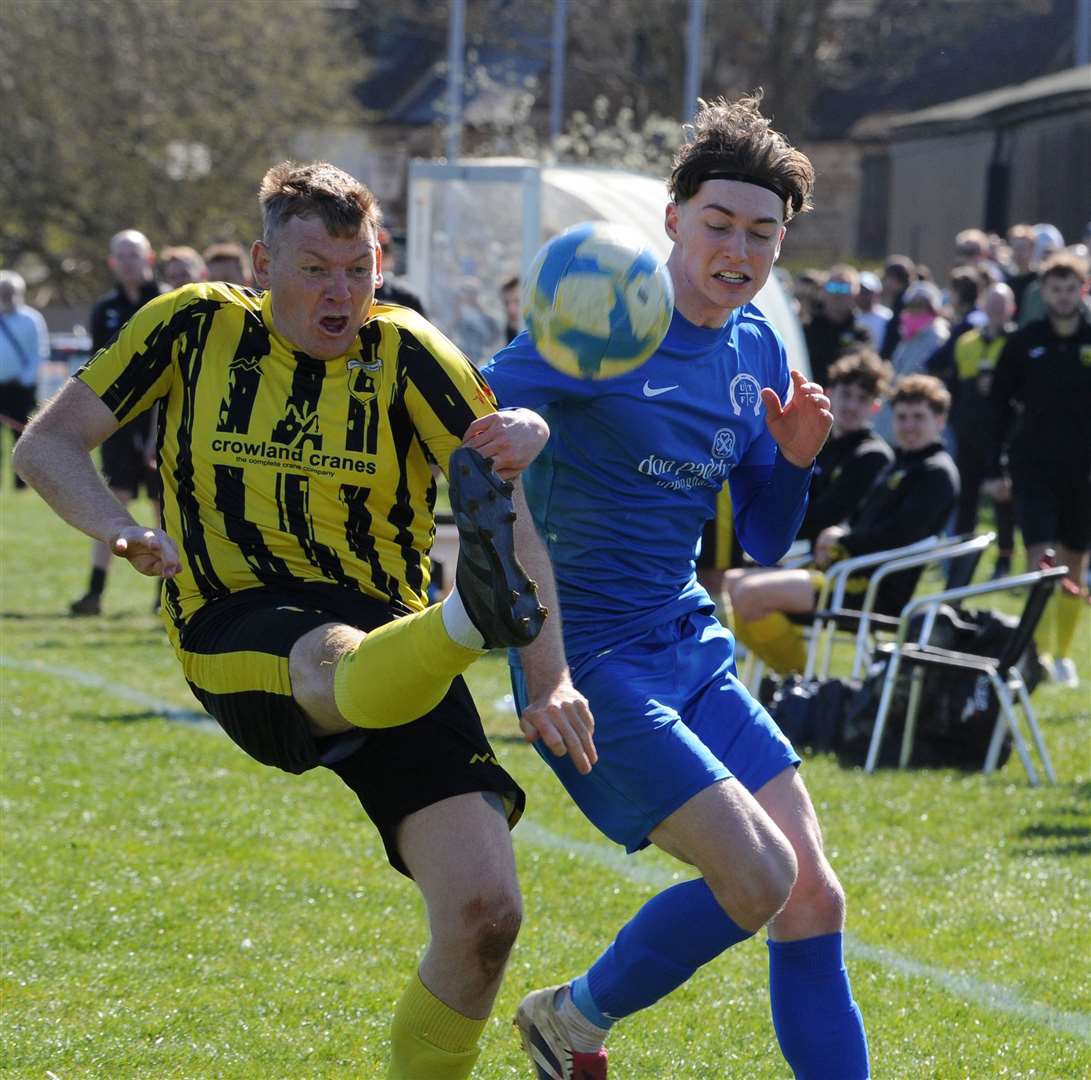 Uppingham Town (blue) on their way to victory over nearest rivals Crowland Town in the Peterborough & District League Premier Division.