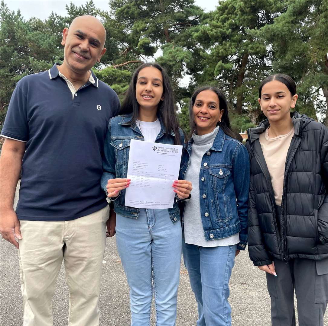 Pupils at Bourne Academy celebrate their GCSE results. Pictured is Zara Thiara-Mahmood, with her family