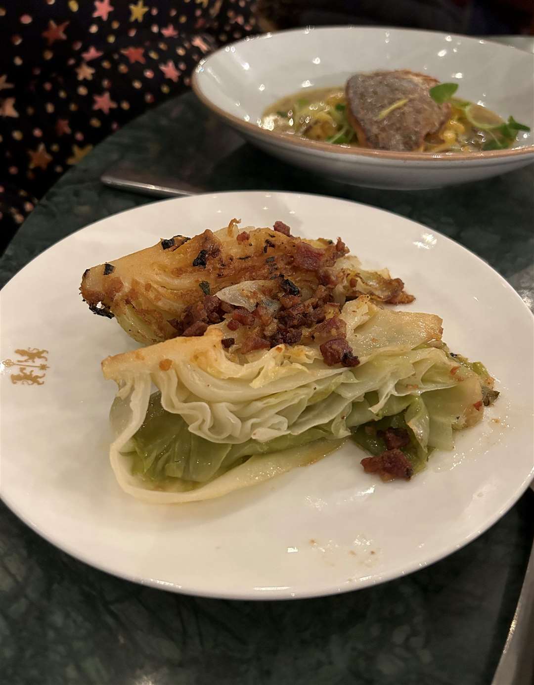 A side of hispi cabbage and bacon added a bit of greenery to the meal
