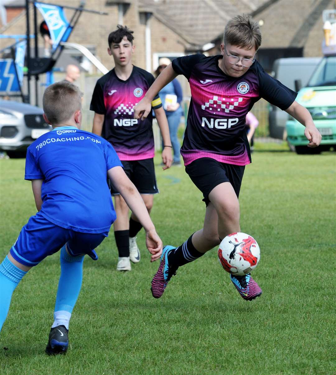 Holbeach United youngsters (black kit) in action at the Knights' tournament. Photo: Chris Lowndes