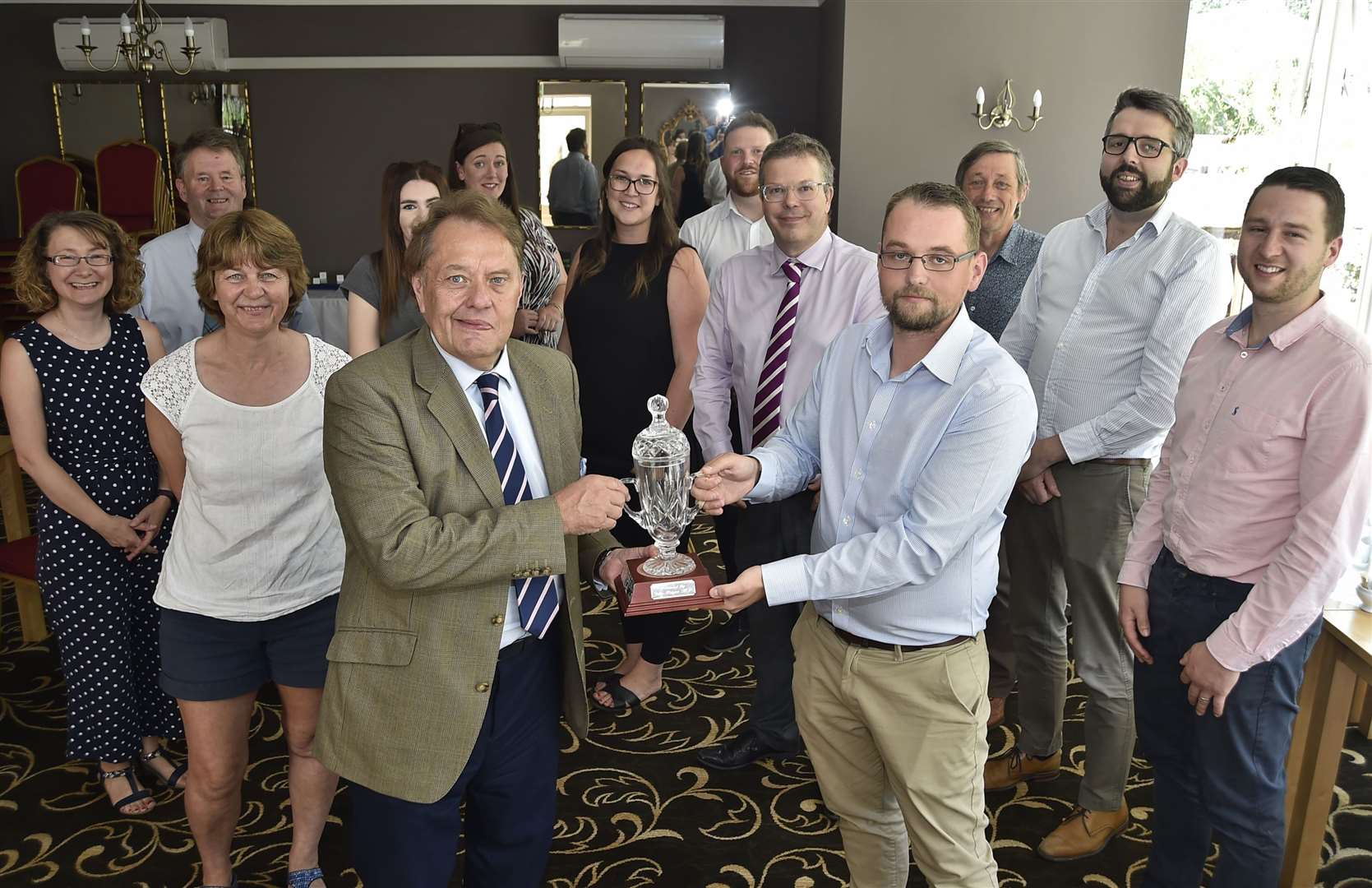 MP Sir John Hayes presents the Butcher's Pride trophy to Antony Burfield of George Adams
