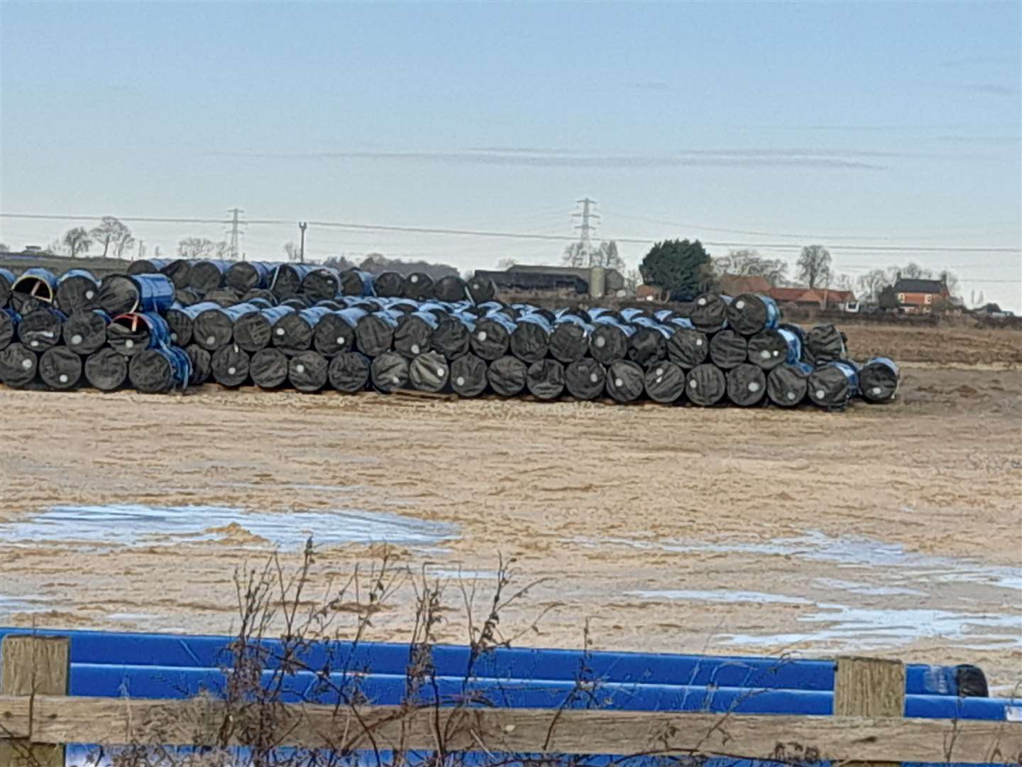 Dozens of pipes for delayed Anglian Water project, stored off Wragby Road in Lincoln - and there are similar scenes in Greatford and Glinton