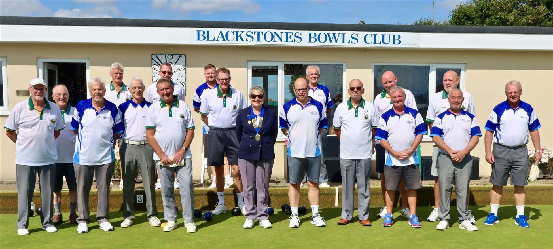 The two teams competing for the Oddfellows Rose Bowl, Blackstones and Oakham, before the start of play, with president Rita Downs.